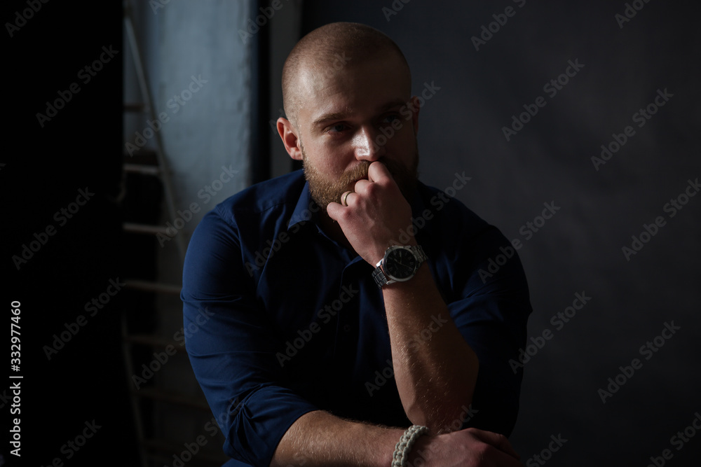 a mysterious portrait of a man with a beard on a black background with a small amount of light a mysterious portrait of a man with a beard on a black background with a small amount of light