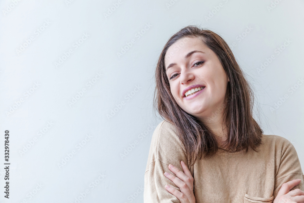 Happy girl smiling. Beauty portrait young happy positive laughing brunette woman on white background isolated. European woman. Positive human emotion facial expression body language Happy girl smiling. Beauty portrait young happy positive laughing brunette woman on white background isolated. European woman. Positive human emotion facial expression body language