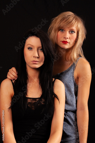 Two young women, low key portrait