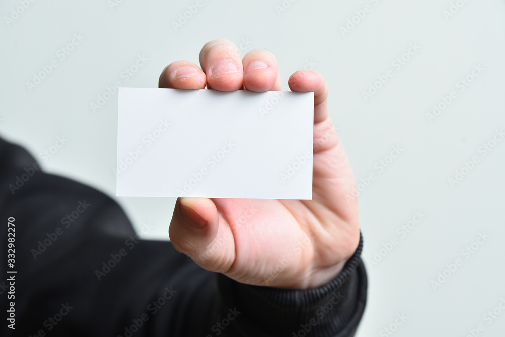 Man hand holding empty blank white card mock up. Man hand holding empty blank white card mock up.