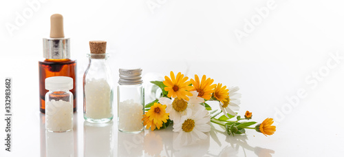 Wild flowers and herbal medicine products isolated on white background