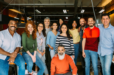 Big group of business people posing in creative office