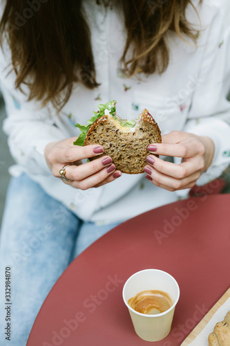 Woman eating sandwich photo