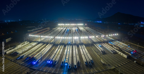 High angle view of train at rail yard shunting at night photo