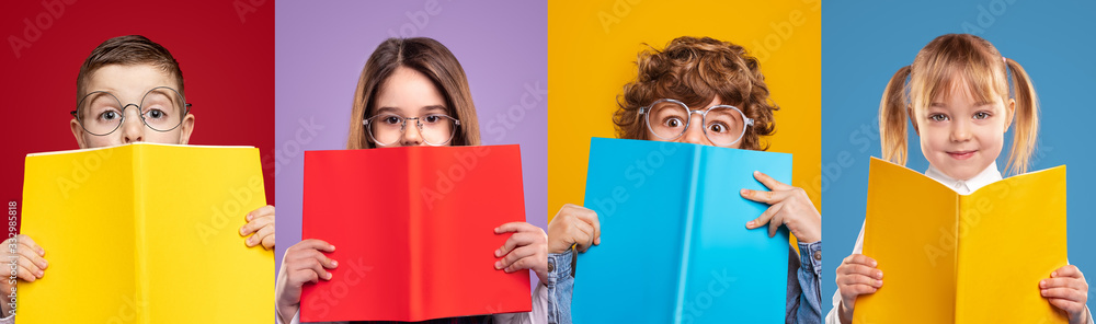 Cute schoolgirls and schoolboys hiding faces with books Cute schoolgirls and schoolboys hiding faces with books