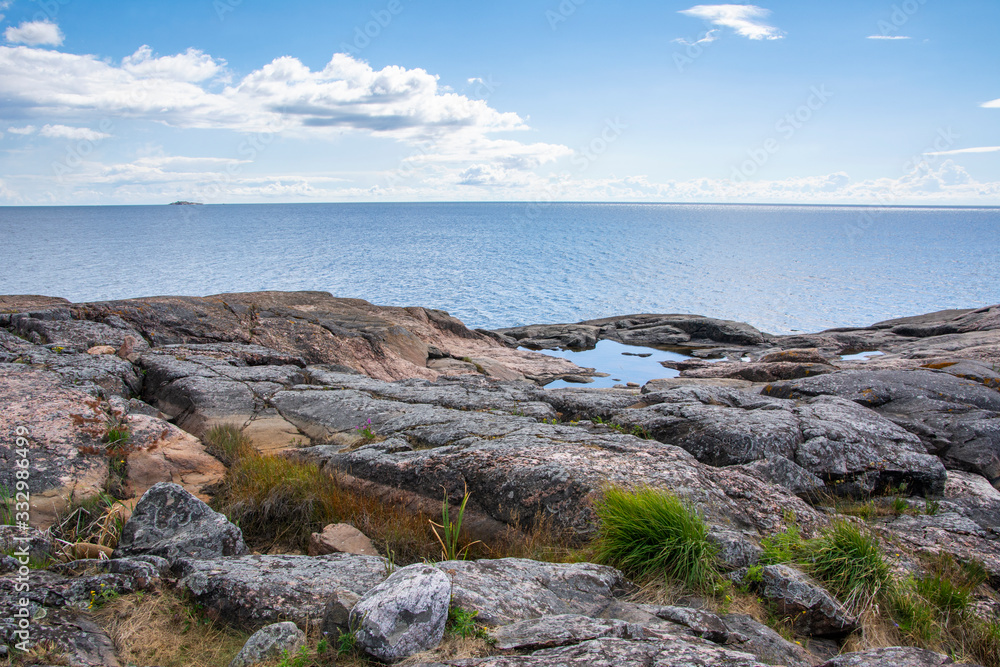 View of the rocky shore and Gulf of Finland on the background, Isosaari island, Helsinki, Finland
