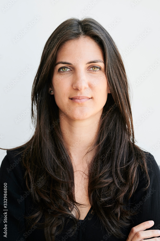Portrait of brunette millennial in studio. Portrait of brunette millennial in studio.