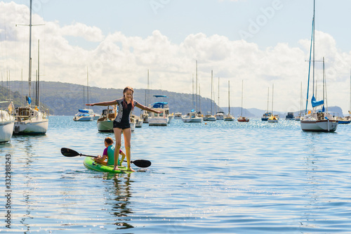 two girls on sea canoe photo