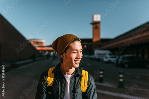 Portrait of stylish asian laughing and looking away