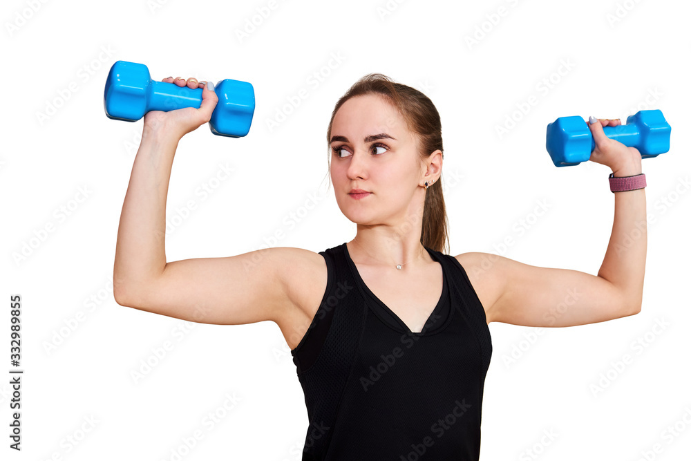 young woman performs an exercise with dumbbells controlling her movements, isolated on white background young woman performs an exercise with dumbbells controlling her movements, isolated on white background