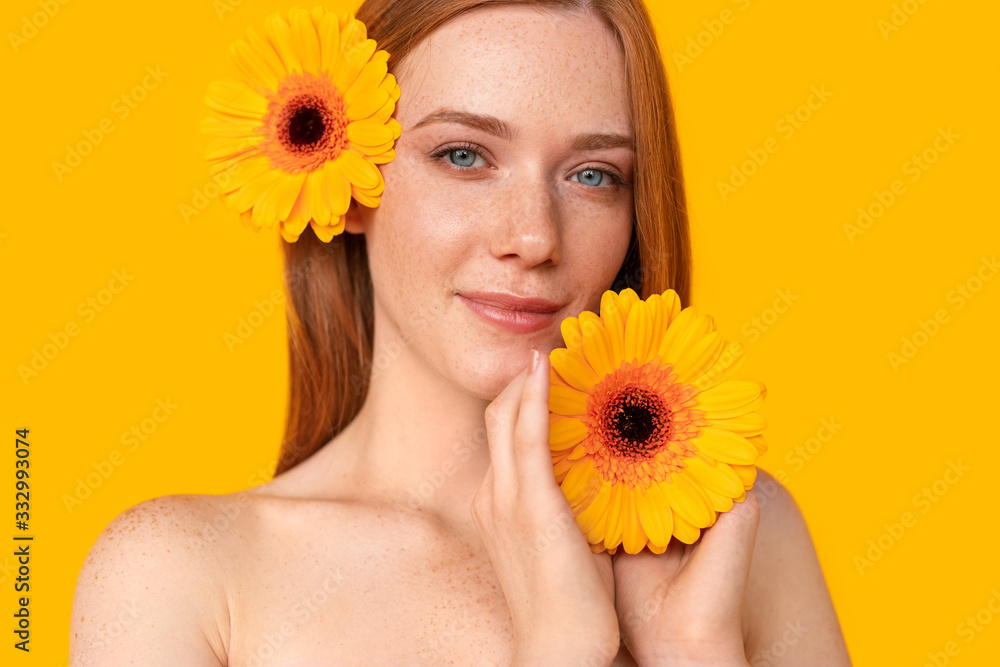 Ginger woman with bright flowers Ginger woman with bright flowers