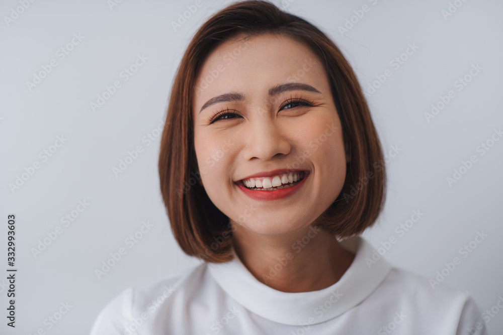 Young Asian pretty cheerful business woman close up portrait Young Asian pretty cheerful business woman close up portrait