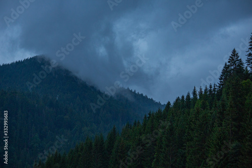 Mighty mountain peak covered in dark clouds, Swiss Alps 