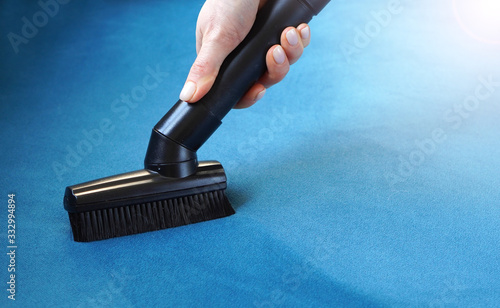 Sofa textile cleaning with vacuum cleaner. Housework background. photo