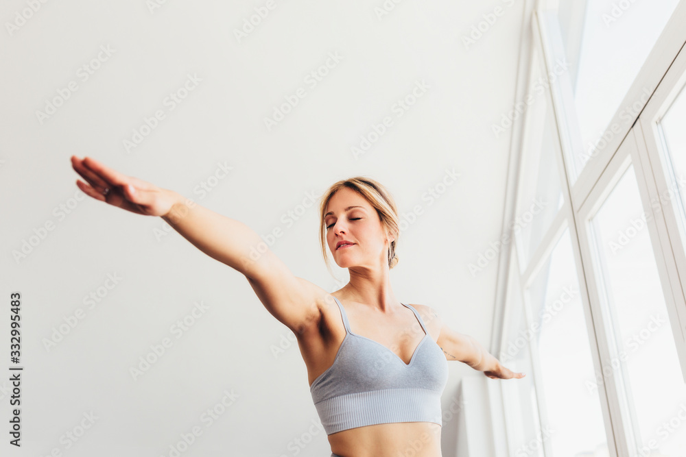 Beautiful young woman doing yoga postures in luxury apartment Beautiful young woman doing yoga postures in luxury apartment