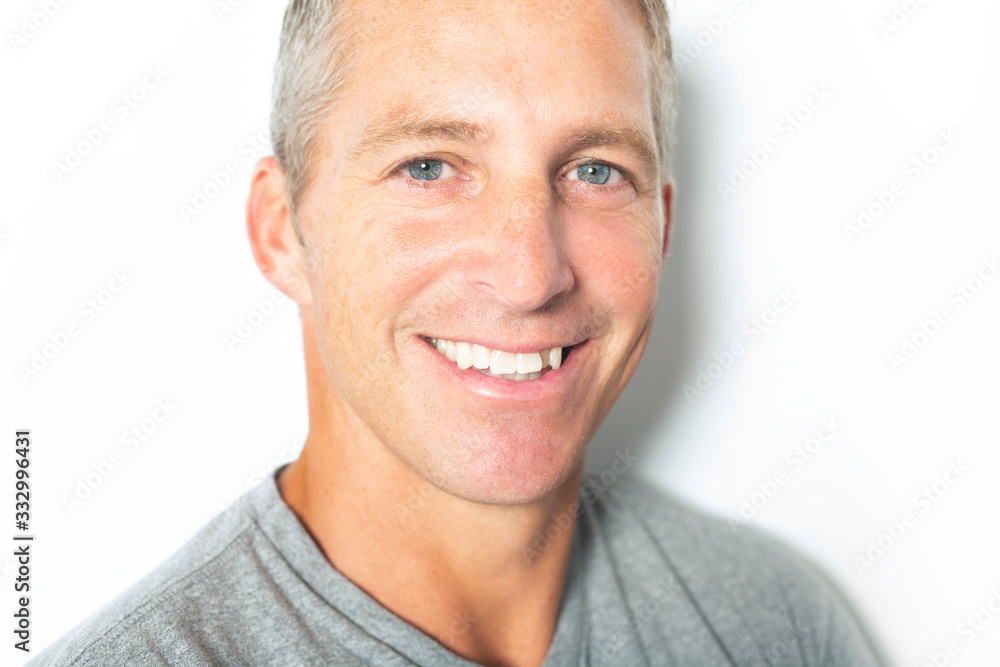 Portrait of confident mature man standing on white background Portrait of confident mature man standing on white background