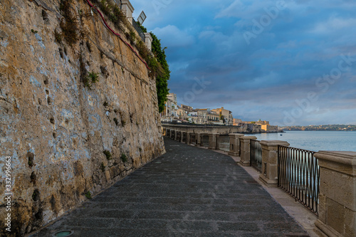 Sea scape of Ortygia island, at early morning with cloud sky, province of Syracuse in Sicily 