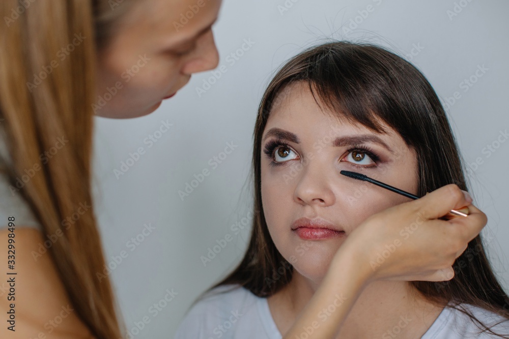 Make up artist working with real woman client Make up artist working with real woman client