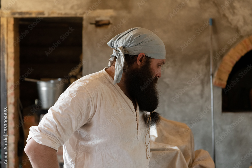 Bearded artisan in bakery Bearded artisan in bakery