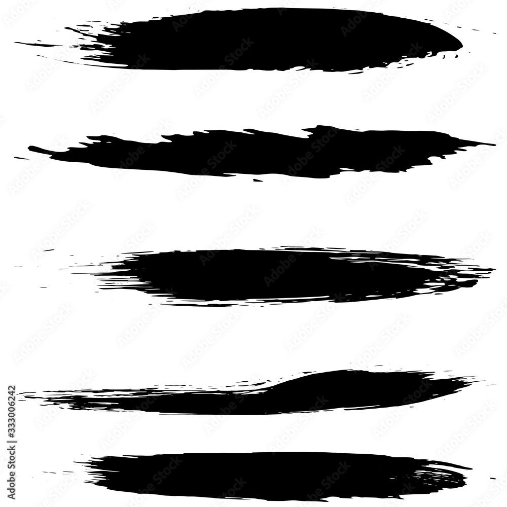 A set of grunge brushes. Abstract strokes of black paint with a dry brush. Blots of ink