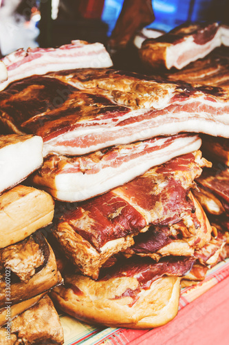 Domestic Traditional Food Smoked Bacon At Local Farmers Marketpl photo