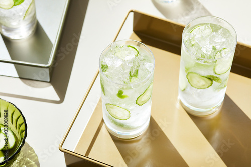 Transparent glasses of mocktail with ice