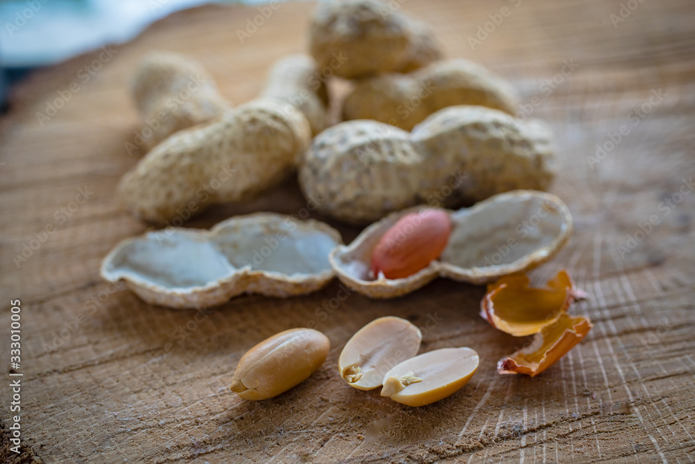 Peanut in a shell and cleared on a neutral background Peanut in a shell and cleared on a neutral background