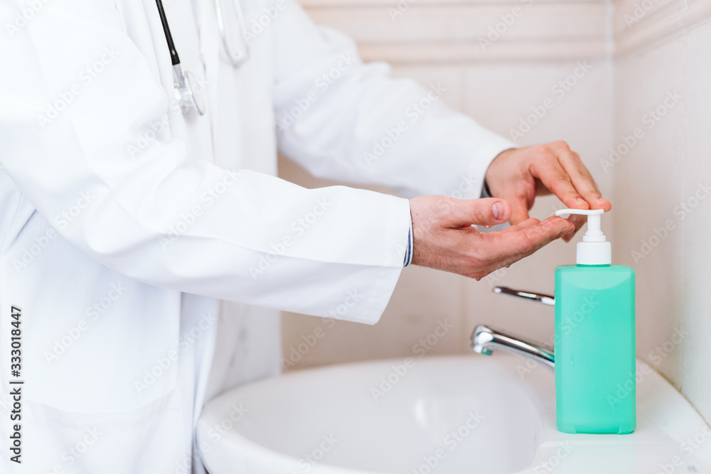doctor man washing hands with disinfectant soap. Hygiene and Corona virus Covid-19 concept doctor man washing hands with disinfectant soap. Hygiene and Corona virus Covid-19 concept