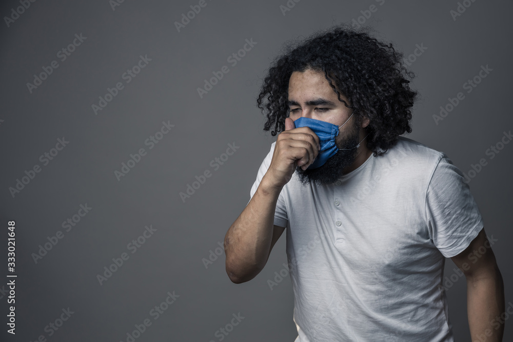 mexican man coughing with face mask mexican man coughing with face mask