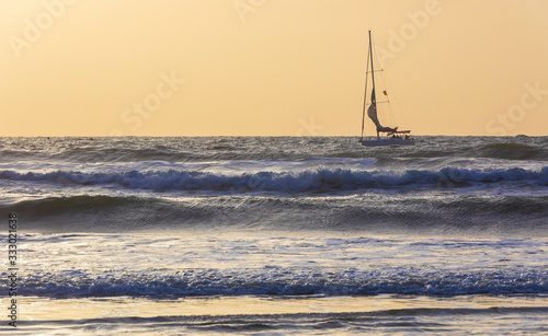Sailboat with people on boa...