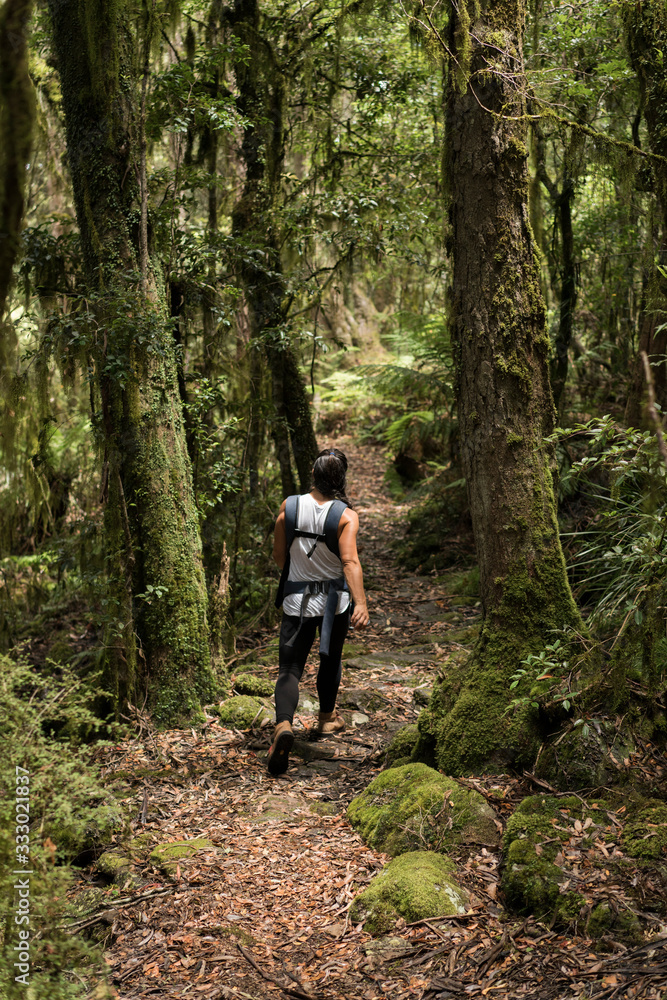 Mother and Daughter hiking in a lush rainforest Mother and Daughter hiking in a lush rainforest