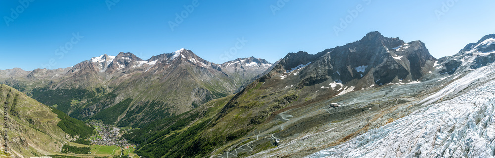 View on Saas-Fee village and disappearing Fee glacier as seen from Langfluh