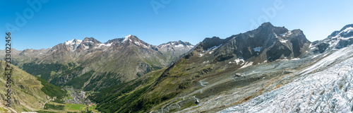 View on Saas-Fee village and disappearing Fee glacier as seen from Langfluh