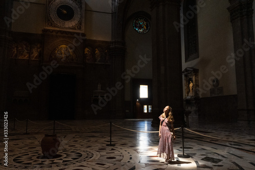 Cathedral light. Lady in church © Marina