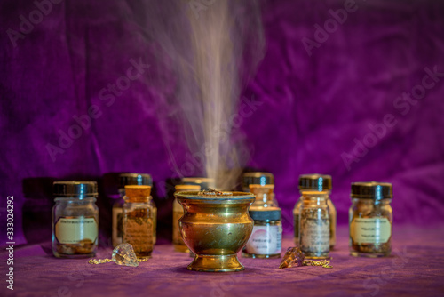 Burning white sage with an incense burner photo