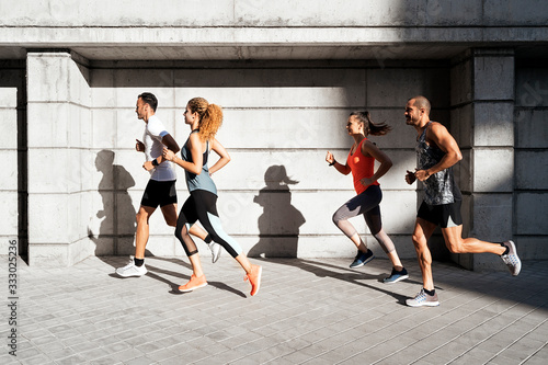 Athletes running in the street photo