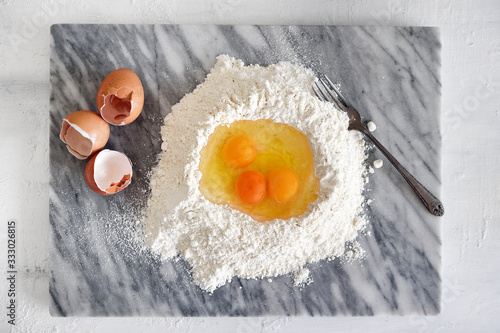 Eggs in a flour well for pasta making