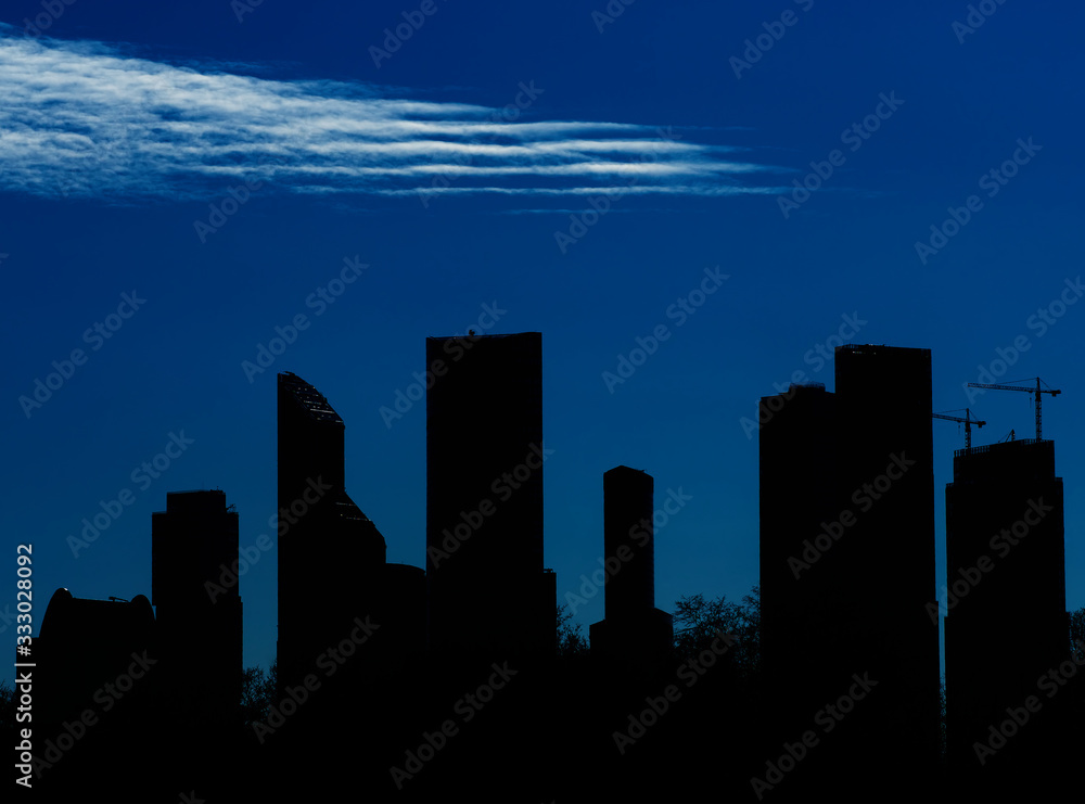 White clouds above silhouette of Moscow city background