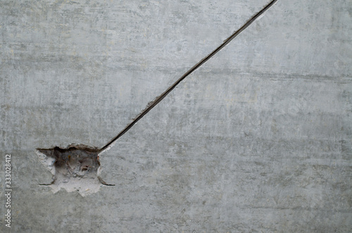 Repair in the apartment. Replacing electrics. Hole in the concrete wall for the wire. Work done with a Rotary Hammer. © Pokoman