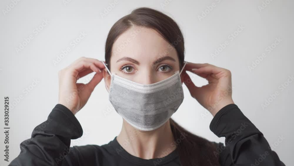 Young woman wearing medical mask on face, healthcare corona virus covid 19 infection pandemic protection lifestyle concept. Human health safety equipment hospital mouth uniform White background. Young woman wearing medical mask on face, healthcare corona virus covid 19 infection pandemic protection lifestyle concept. Human health safety equipment hospital mouth uniform White background.