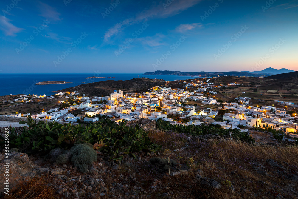 Chora village on Kimolos and Milos island in the distance. Chora village on Kimolos and Milos island in the distance.