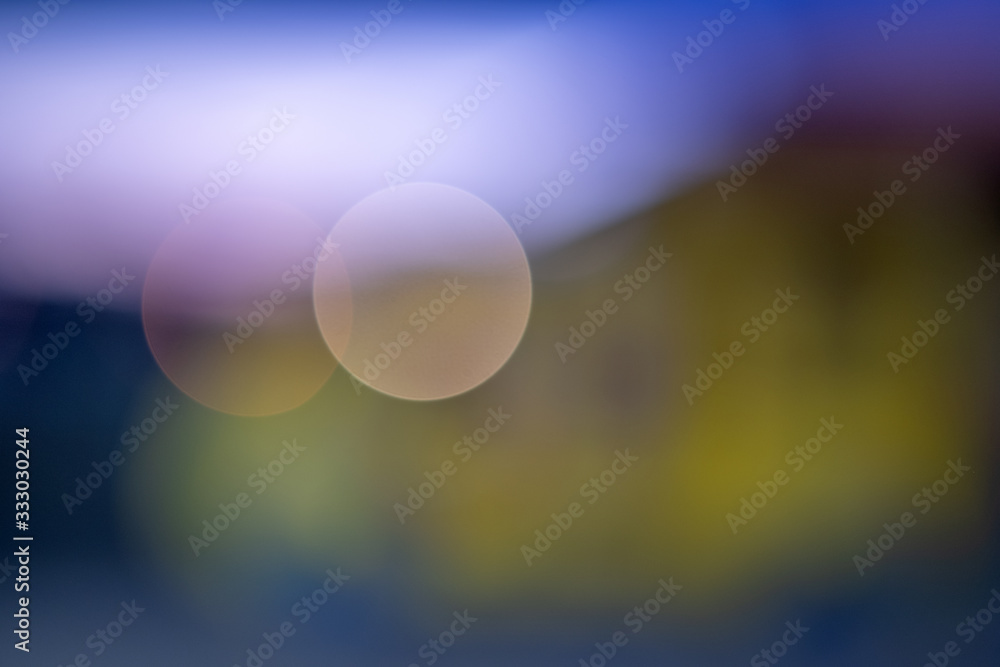 Bright colorful bokeh circles at night. Blurred city lights background.