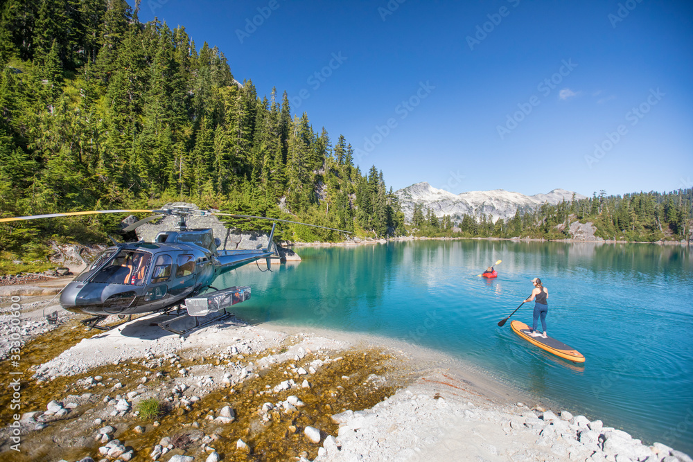 © Cavan Images - Mother and daughter paddling on stunning blue lake during tour.