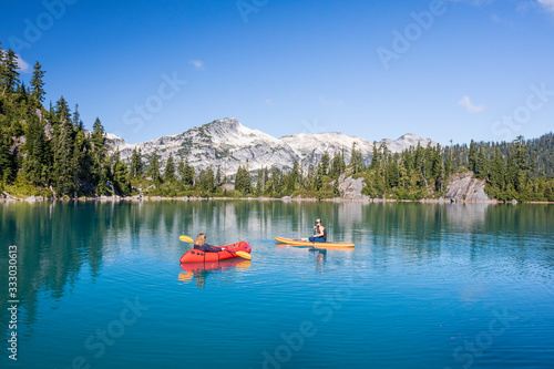 Mother and daughter enjoy life at the lake during a family vacation.