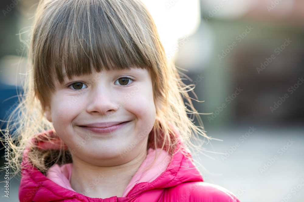 Portrait of a pretty child girl outdoors on a sunny warm autumn day. Portrait of a pretty child girl outdoors on a sunny warm autumn day.