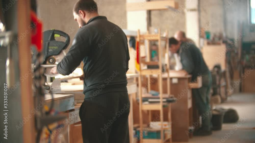 Carpentry industry - men working in the workshop Carpentry industry - men working in the workshop