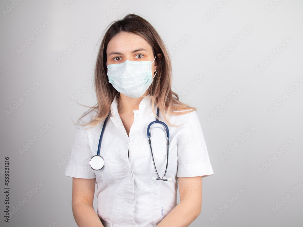 A woman doctor at work in a hospital is excited and happy with her profession. Brunette woman doctor Concept of medicine and health care A woman doctor at work in a hospital is excited and happy with her profession. Brunette woman doctor Concept of medicine and health care