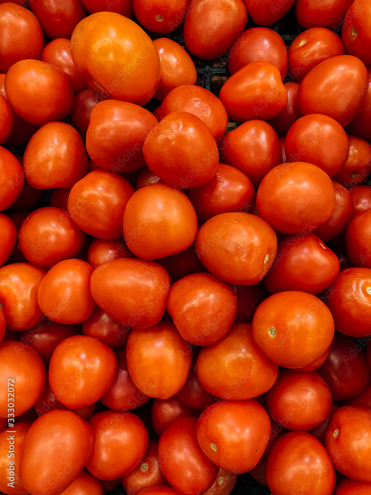 lots of red ripe tomatoes for eating like a background