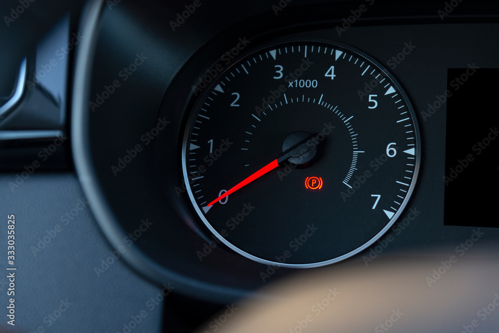 handbrake icon on the dashboard. Modern light car mileage