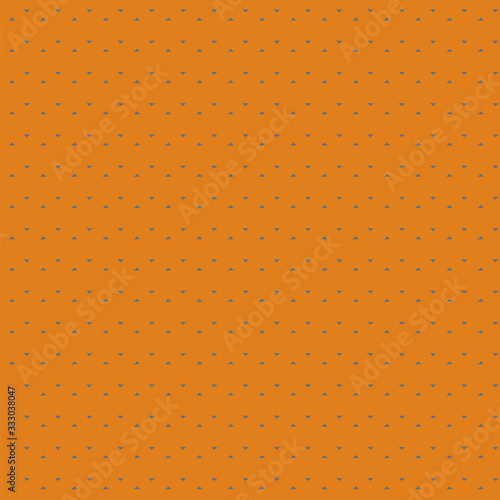 Seamless pattern of small triangles floating on a curry color background